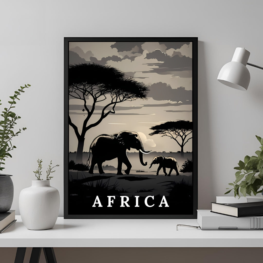 A framed travel poster featuring a minimalist black and beige African savanna scene with an elephant and calf, displayed on a white shelf in a styled room setting.