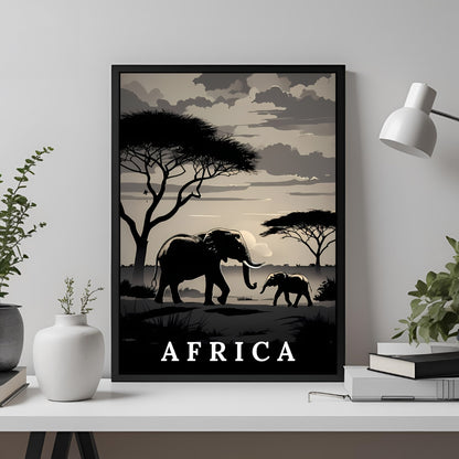 A framed travel poster featuring a minimalist black and beige African savanna scene with an elephant and calf, displayed on a white shelf in a styled room setting.