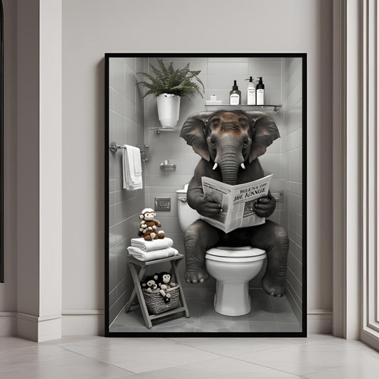 Framed artwork of an elephant reading a newspaper in a bathroom setting.