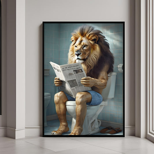 Framed artwork of a lion sitting on a toilet reading a newspaper in a bathroom setting.
