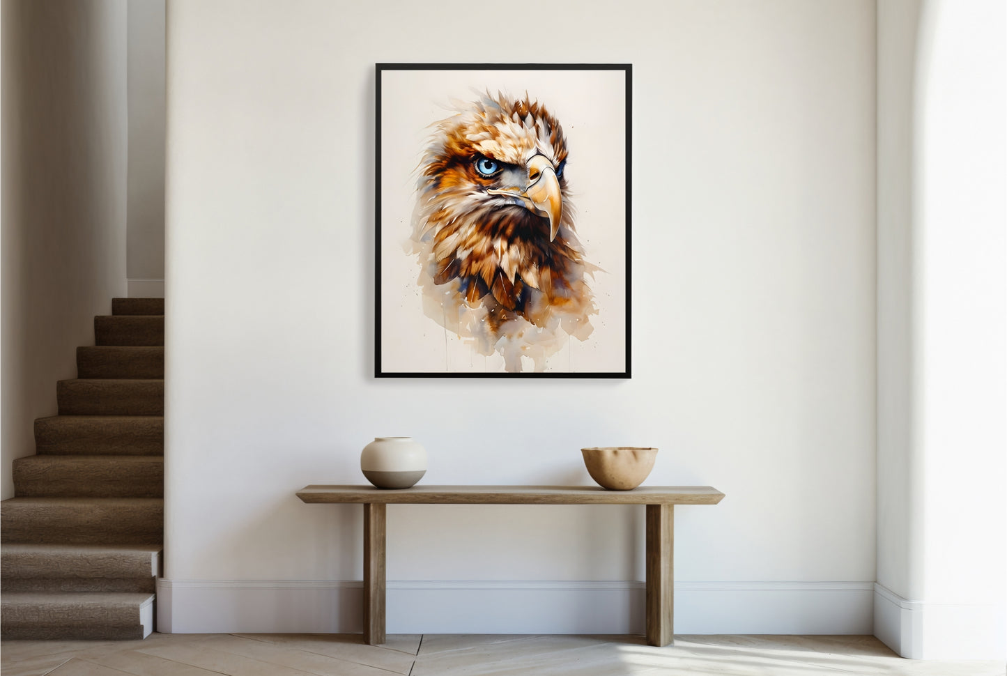 A framed print of a powerful eagle head, painted with flowing watercolor and featuring fierce blue eyes.