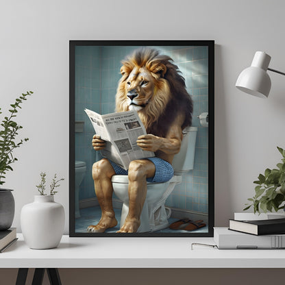 Framed artwork of a lion sitting on a toilet reading a newspaper in a bathroom setting.